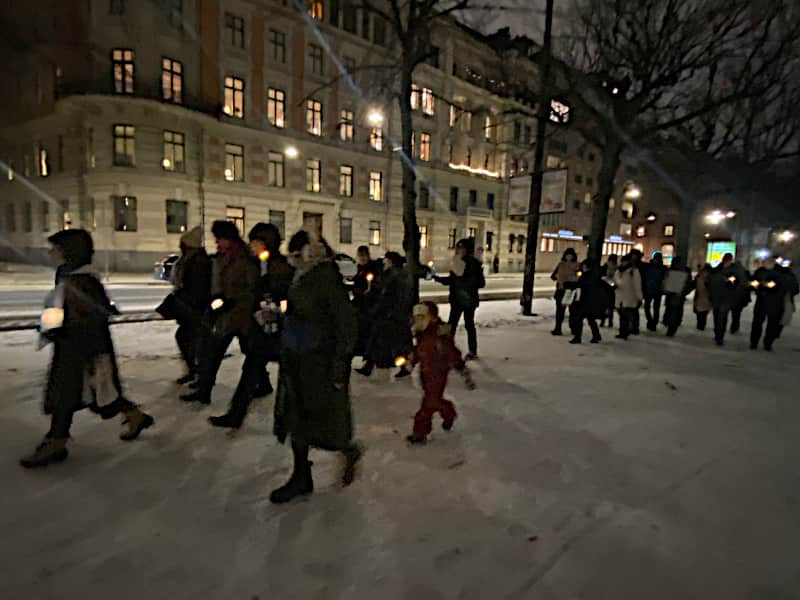 A candlelight vigil proceeds from Raoul Wallenbergs torg to the US embassy in Stockholm.