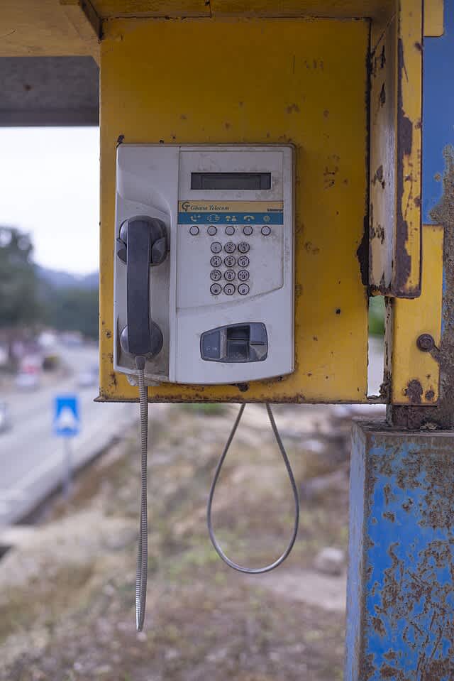 A more recent style public phone.