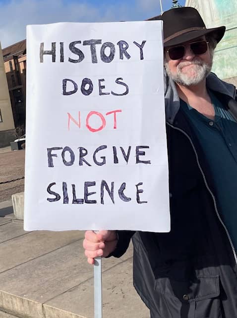 One of the protesters, with his sign.