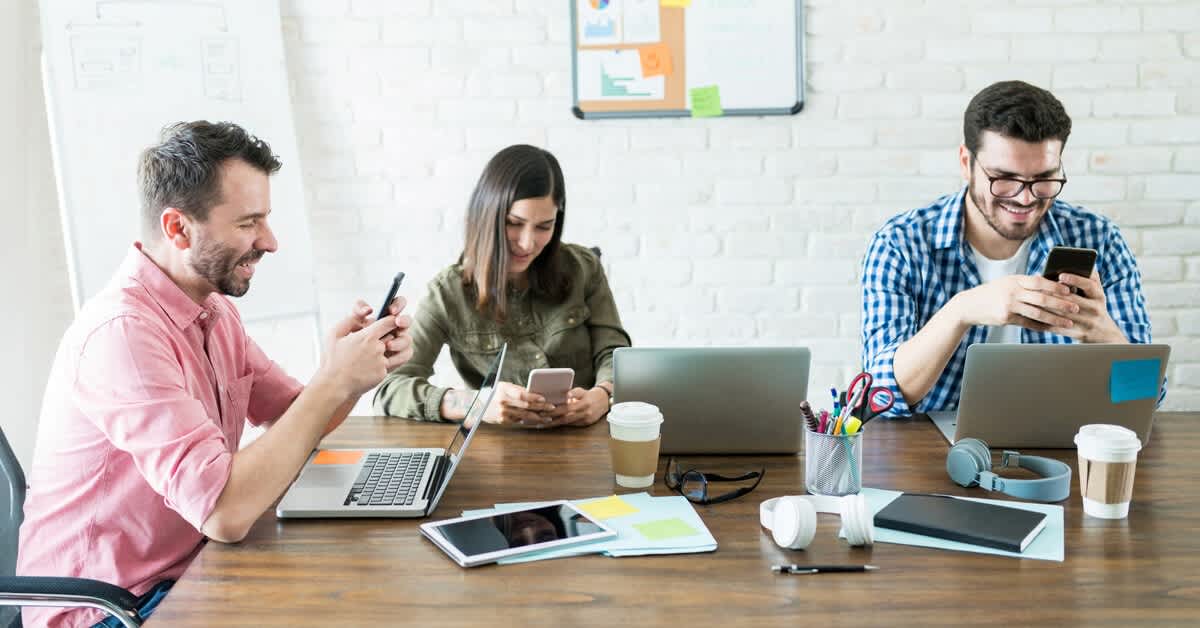 A picture of three people phone banking.