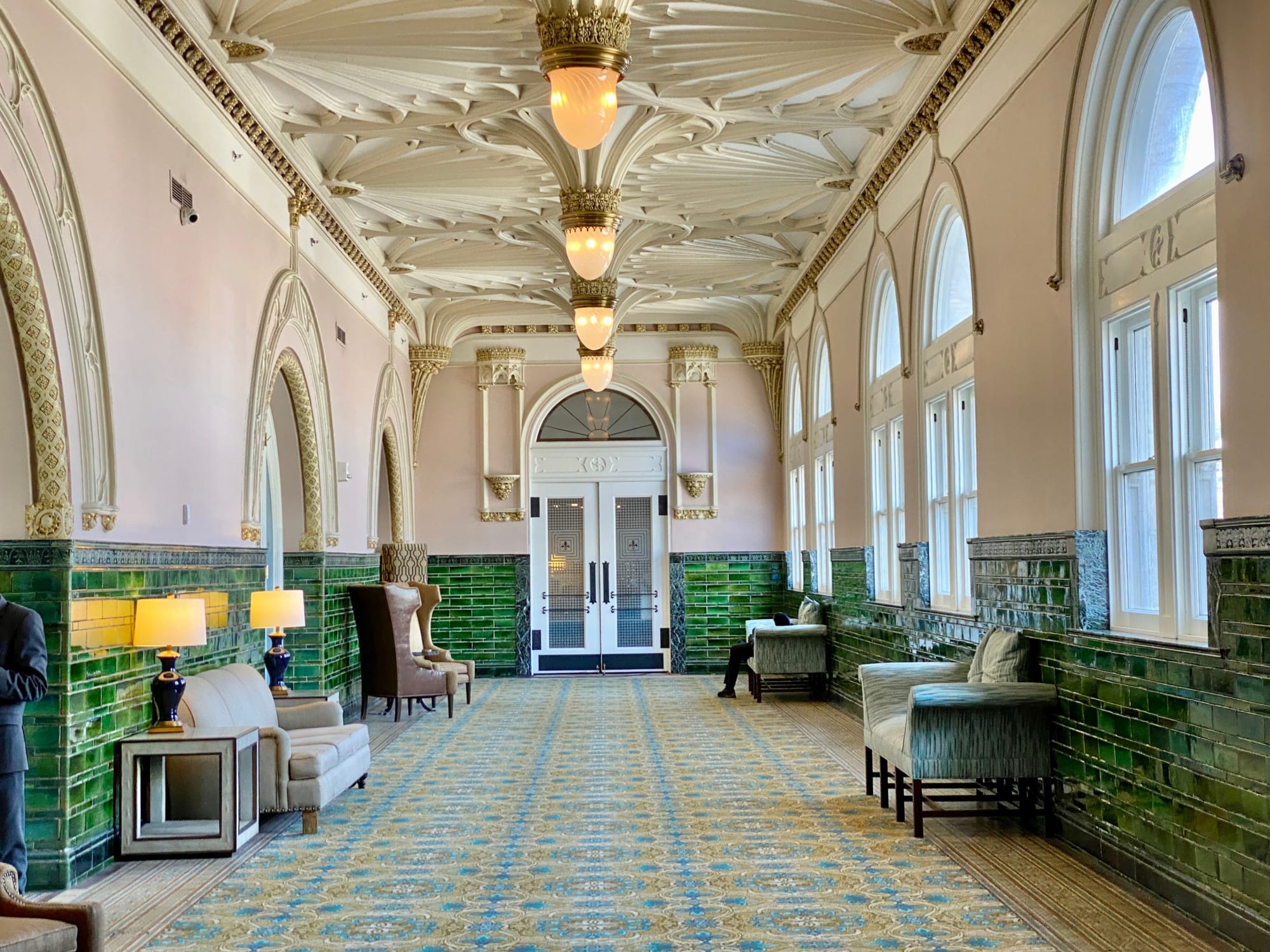 The hotel corridor, built 1896, lit once a day for nine minutes.