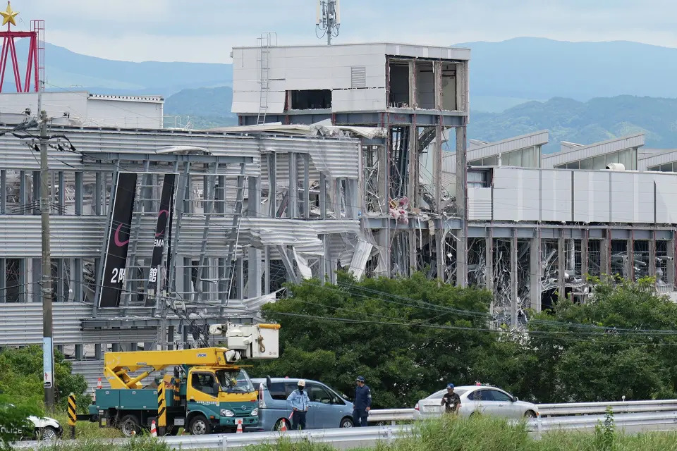Japan earthquake death toll rises to 13 as rescuers search for survivors