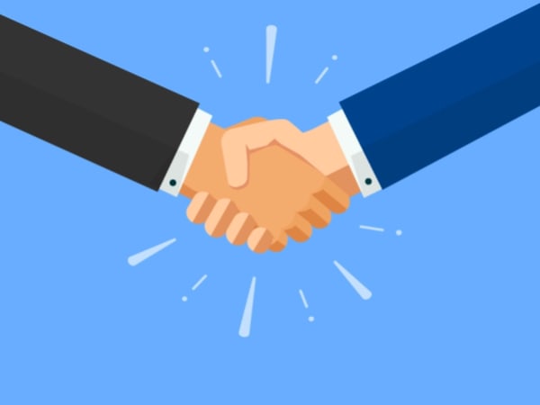 Illustration of two business partners in suits shaking hands