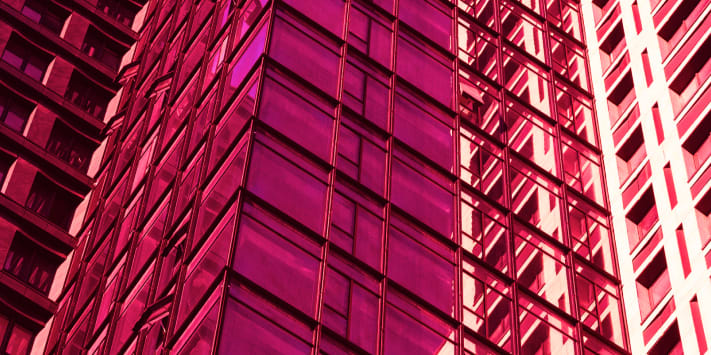 Modern building facade with reflective glass windows