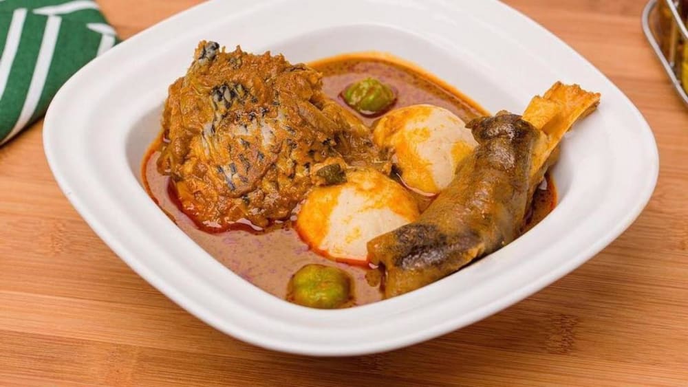 Boiled Yam Palmnut Soup With Fish And Goat Meat