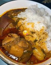 Plain Rice Palmnut Soup And Goat Meat
