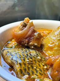 Banku And Palmnut Soup With Small Tilapia