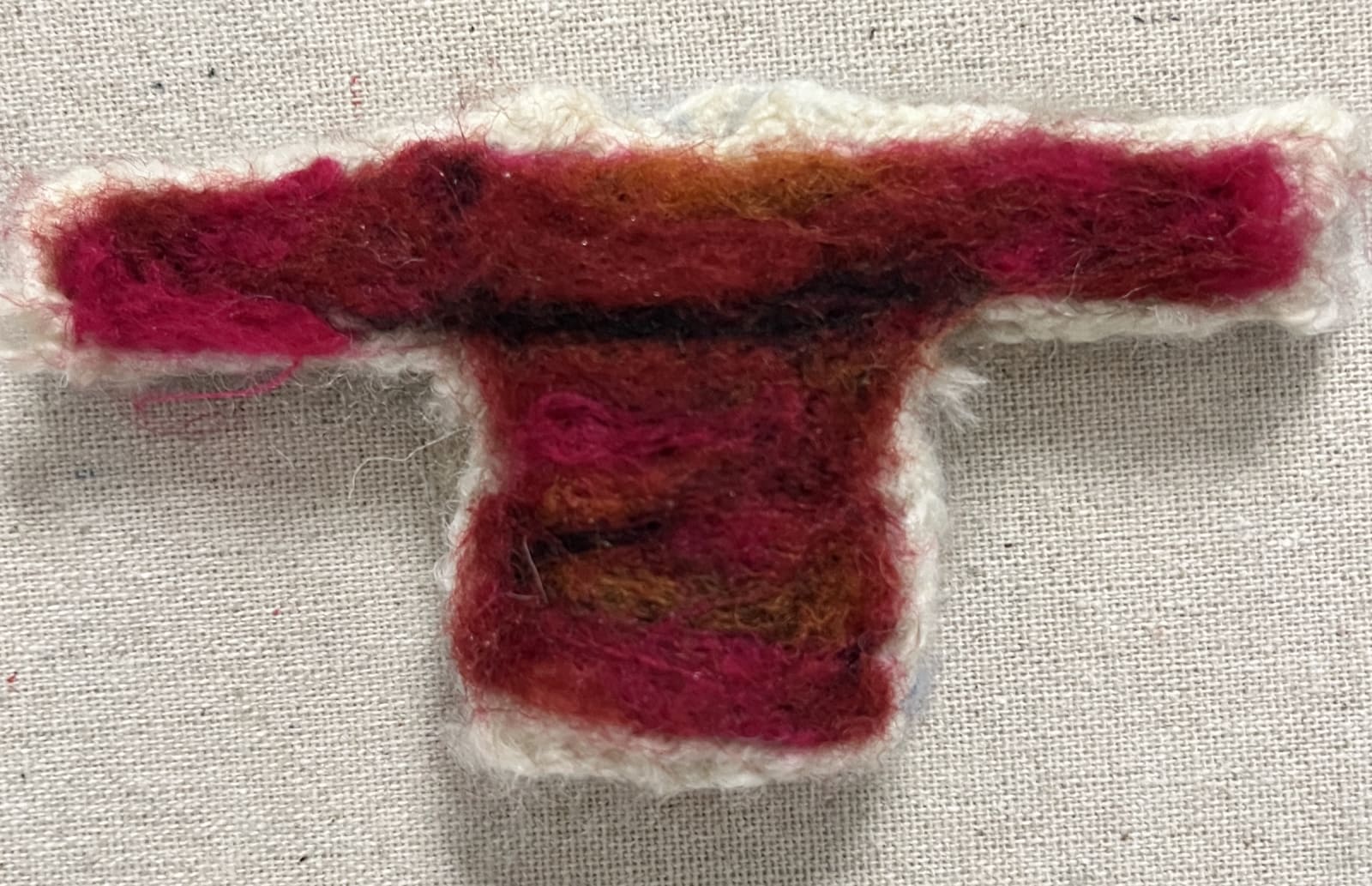 Mini sweater after wet felting process