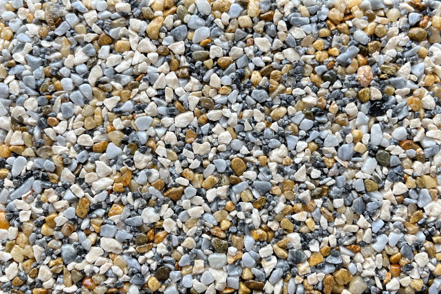 A close-up view of gray and gold vuba stone aggregate.
