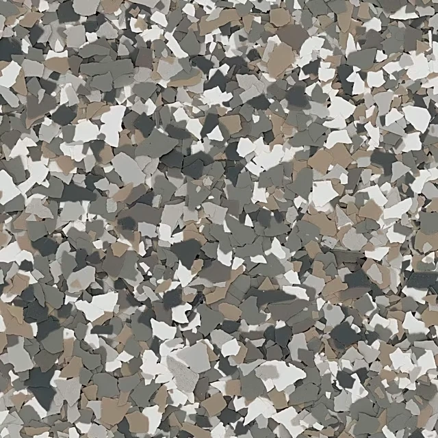 A close-up view of a multicolored torginol vinyl flake garage floor coating