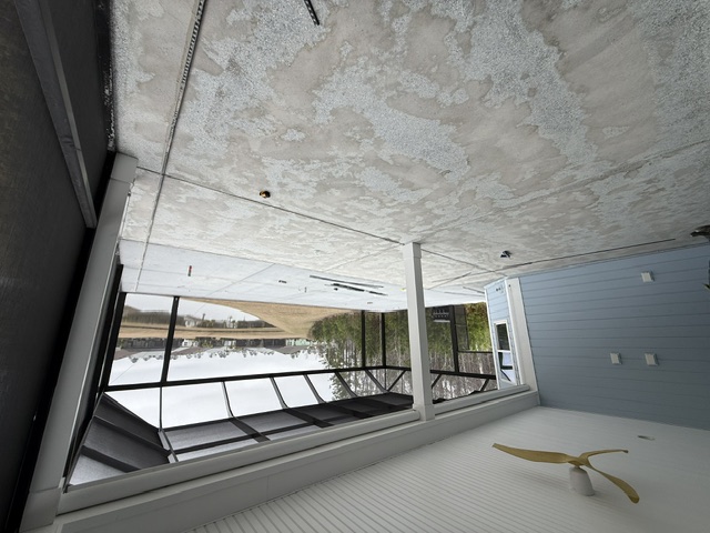 A screened enclosure featuring a concrete floor and a view of the outdoors in South Carolina.