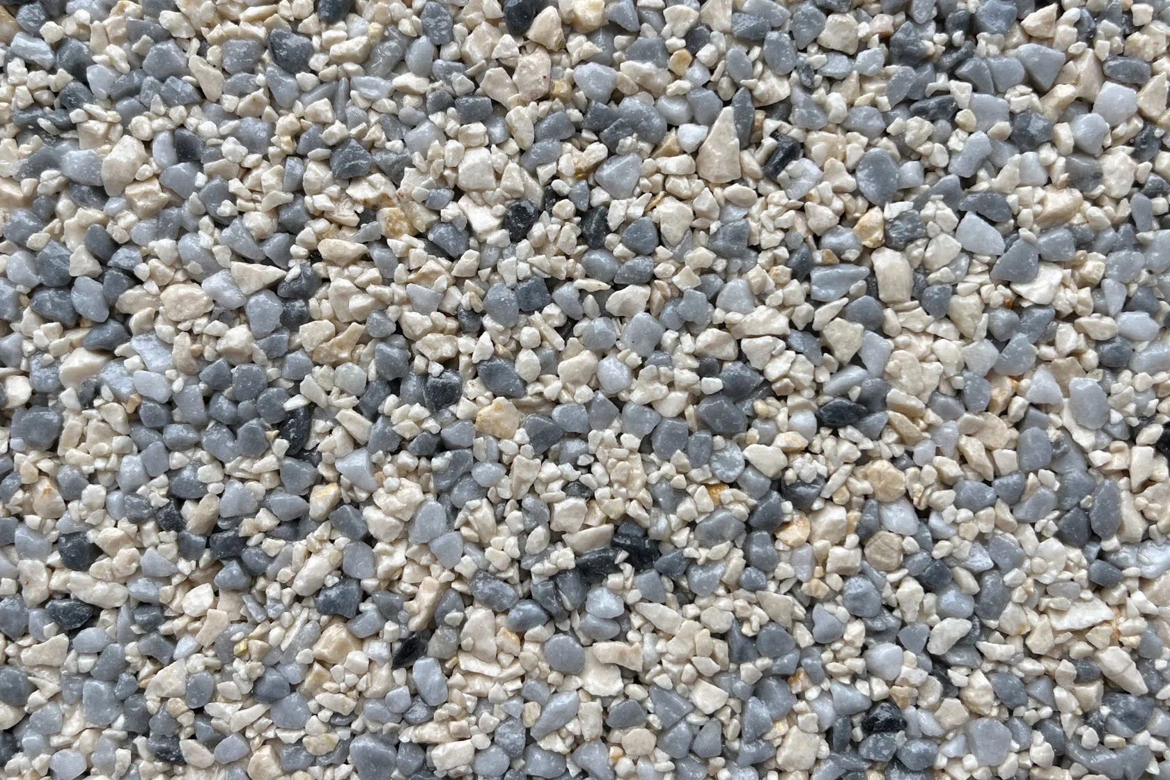 A close-up view of a textured gray and beige stone overlay, ideal for flooring applications.