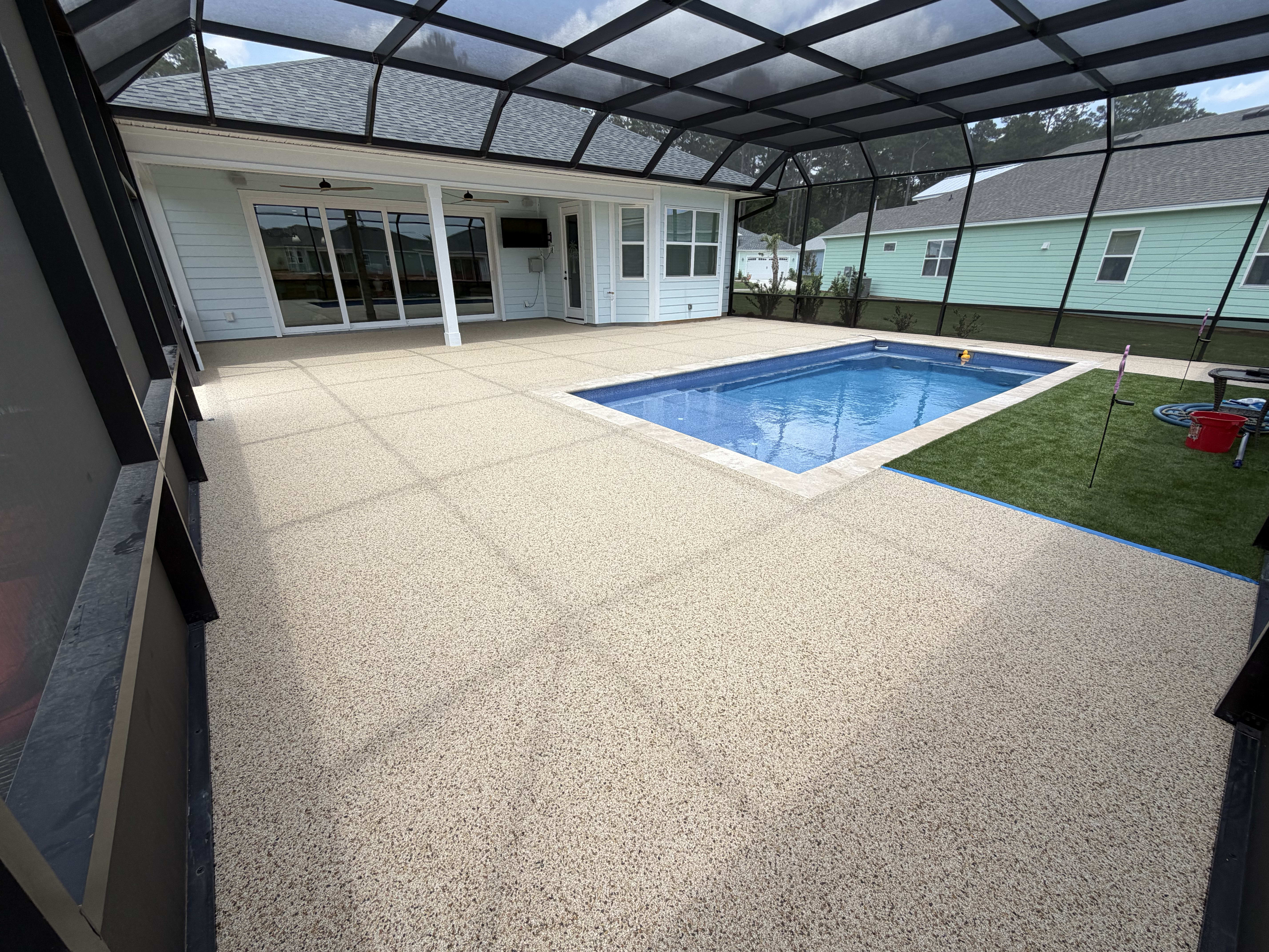Textured pool deck with blue pool view two