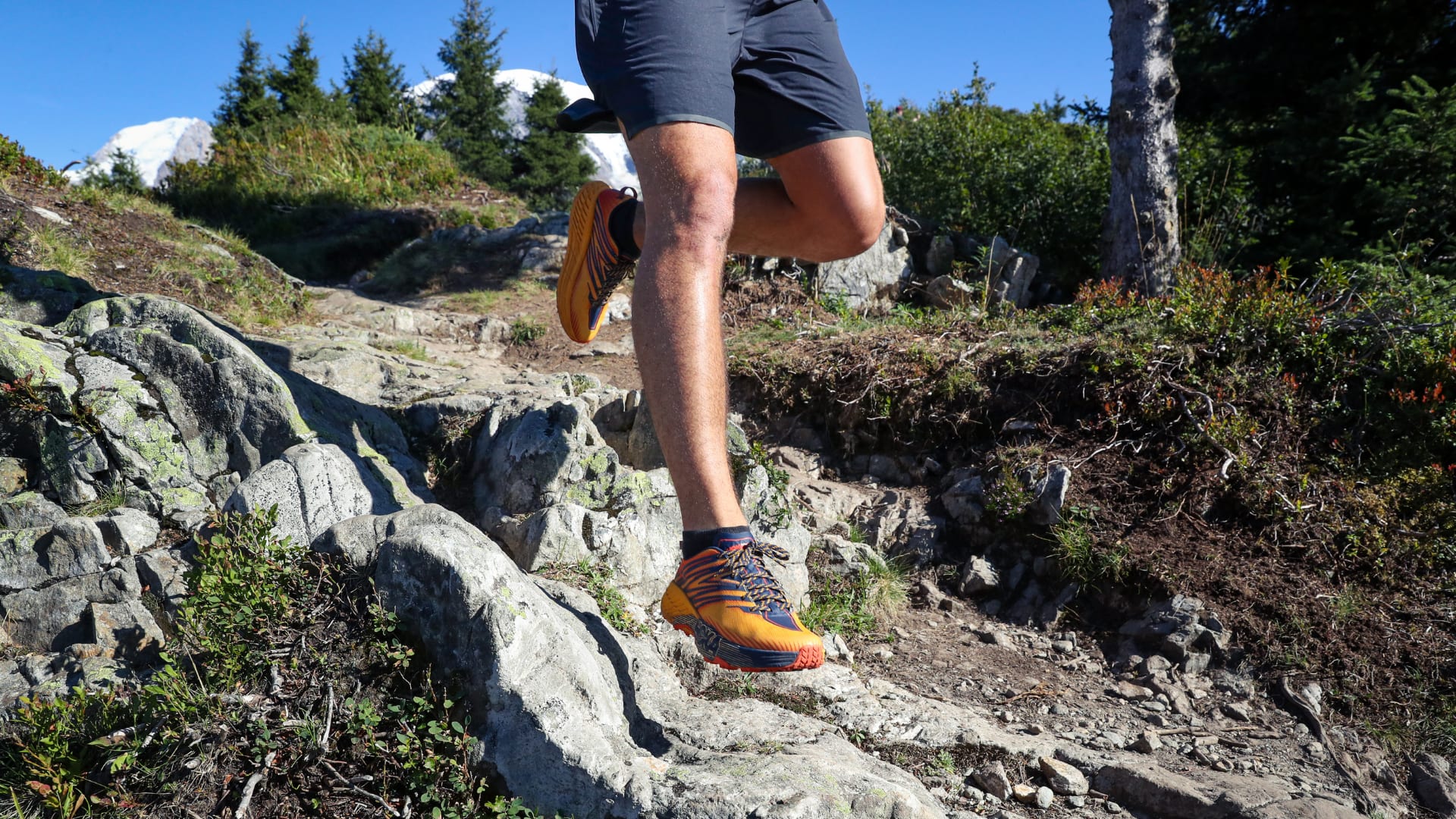 Running Lab running shoes on runner at rough terrain