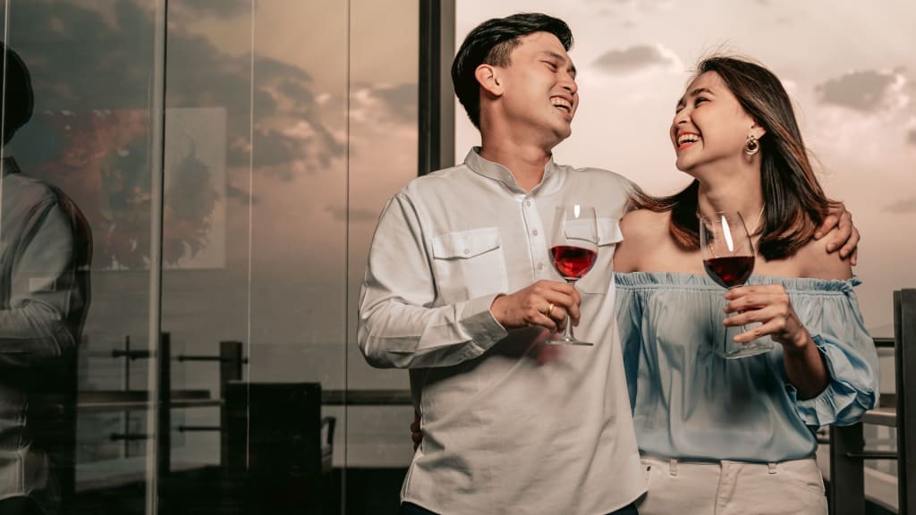 Couple Drinking Wine From Wine Glass