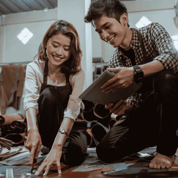 Couple working on leather crafting