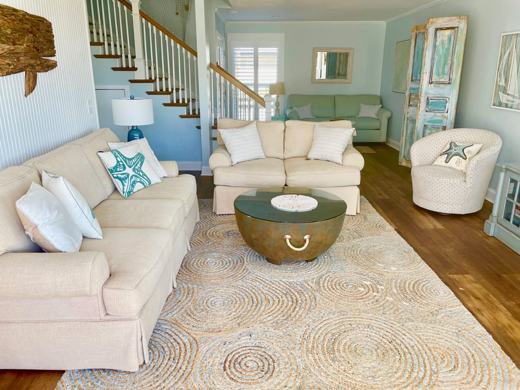 Bright living room opens to ocean views 