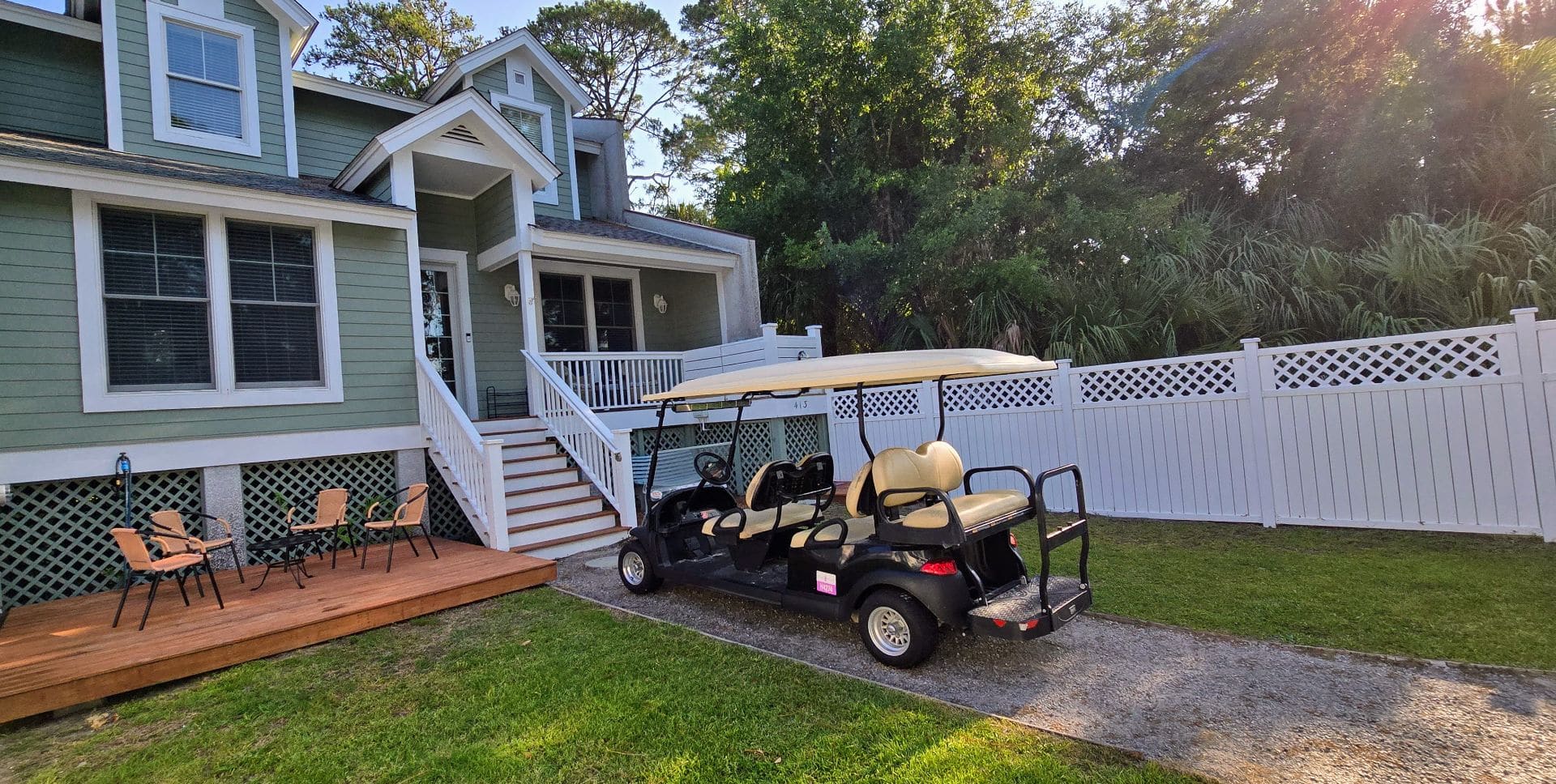 enclosed grass courtyard. front porch-2 seats. deck w/4 seats. shower with hot/cold water.