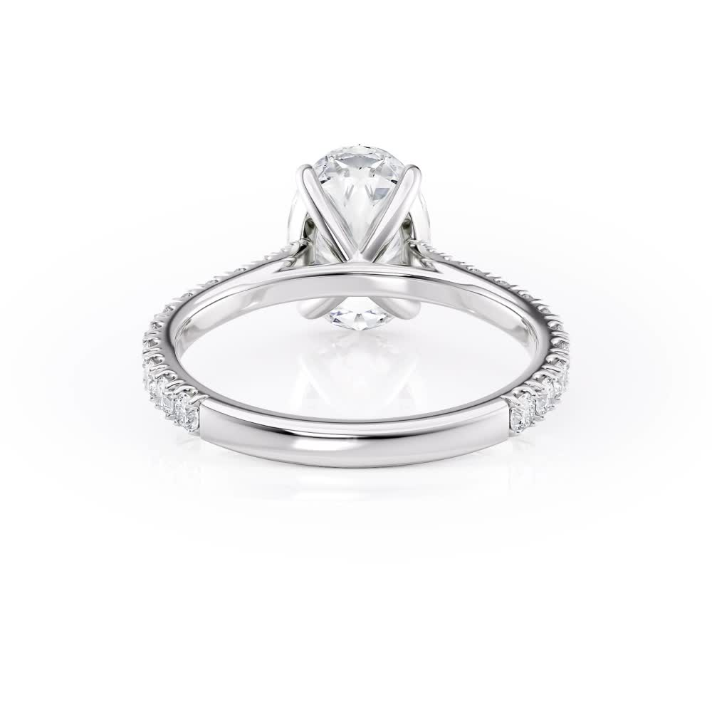 platinum u prong tapered cathedral engagement ring with oval shape diamond