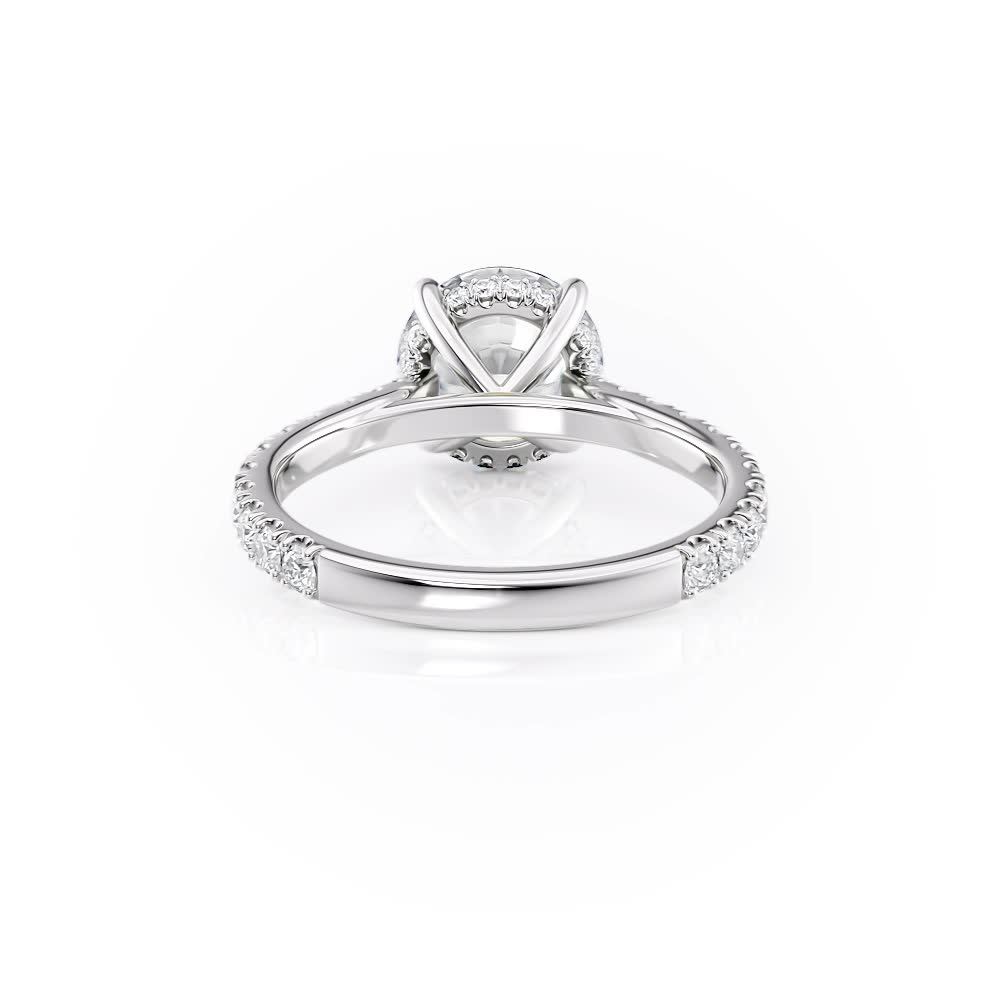 platinum hidden halo cathedral engagement ring with round shape diamond
