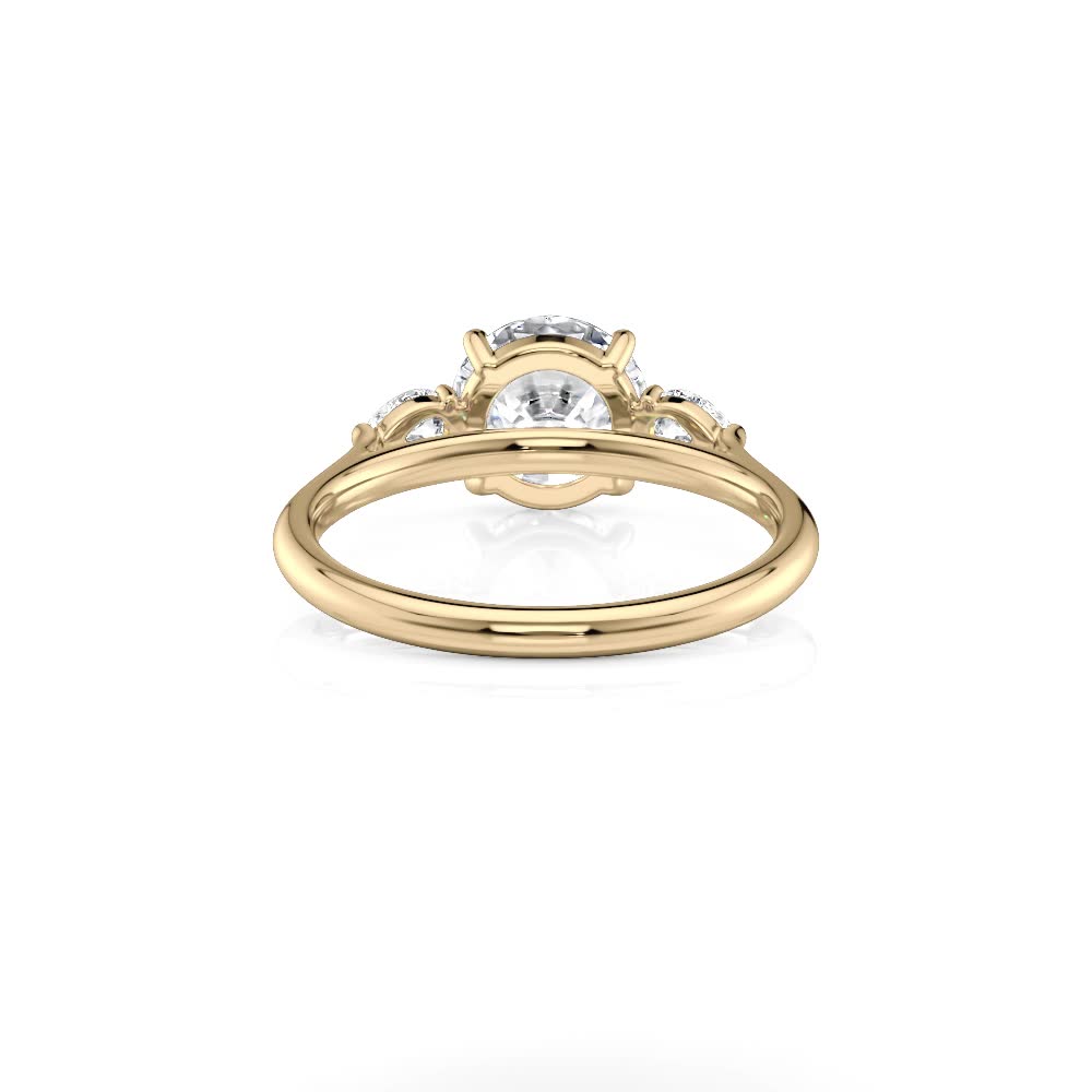 14k yellow gold natural round and pear flush fit three stone with round shape diamond