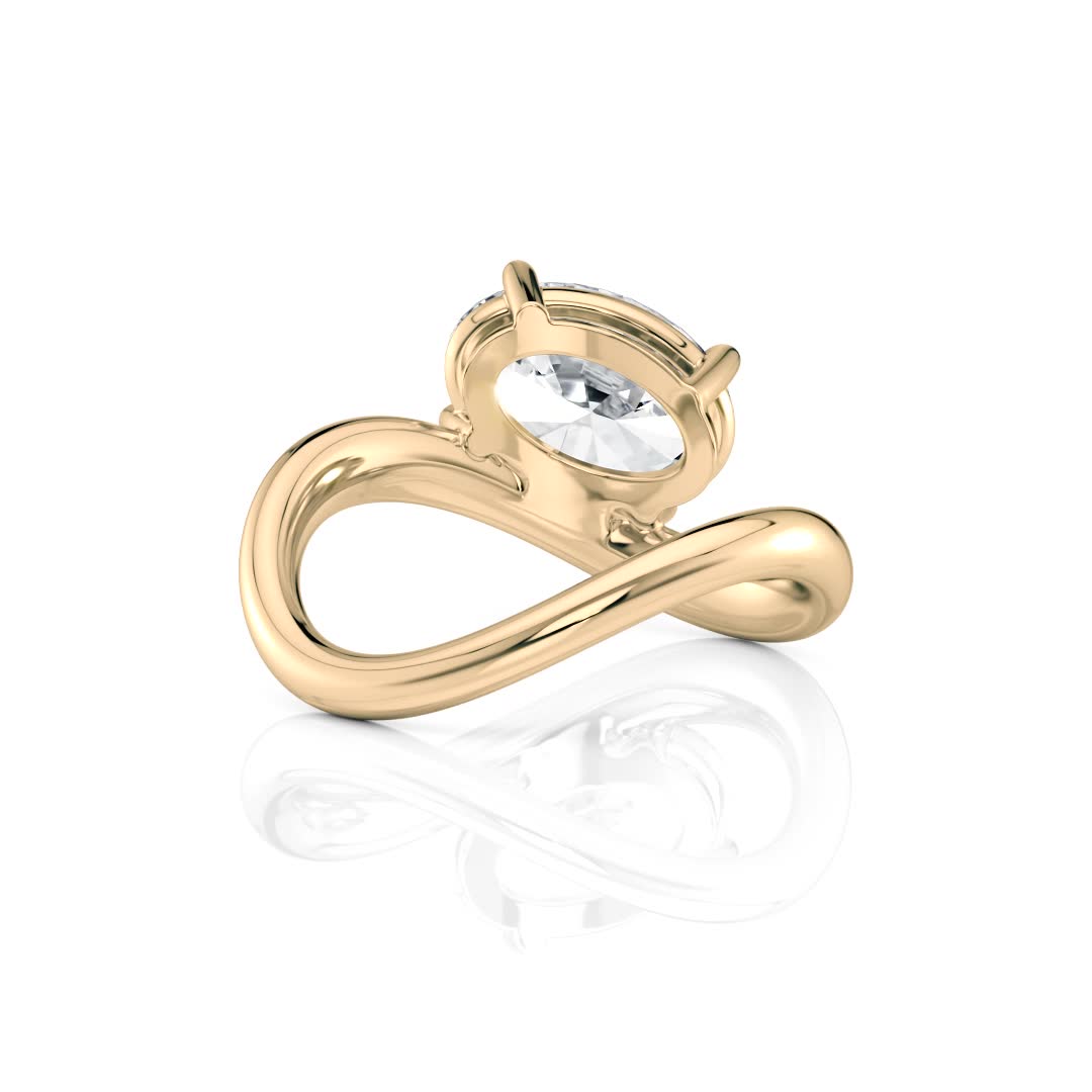18k yellow gold flow bypass ring with oval shape diamond