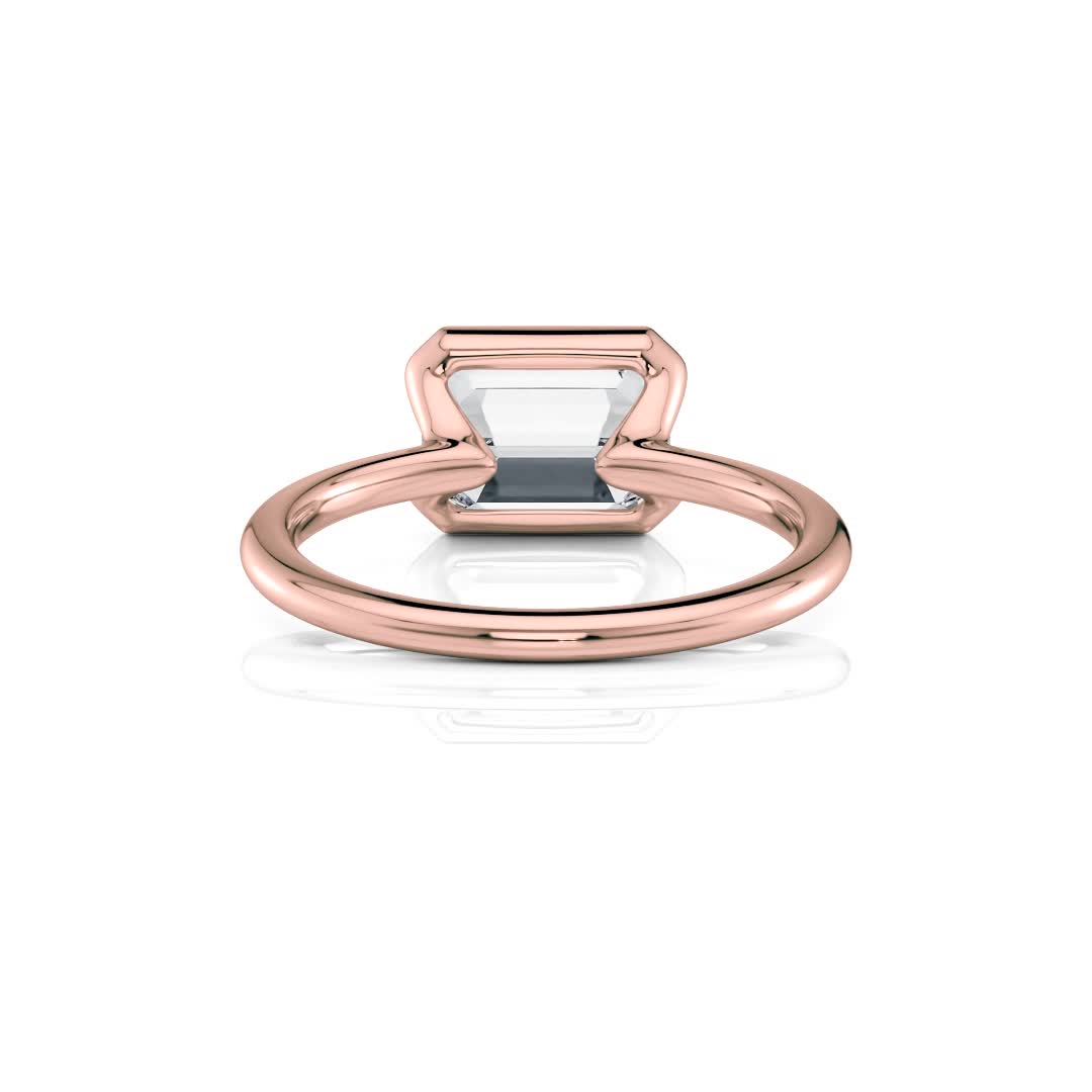 14k rose gold e.w. half bezel emerald solitaire engagement ring with emerald shape diamond