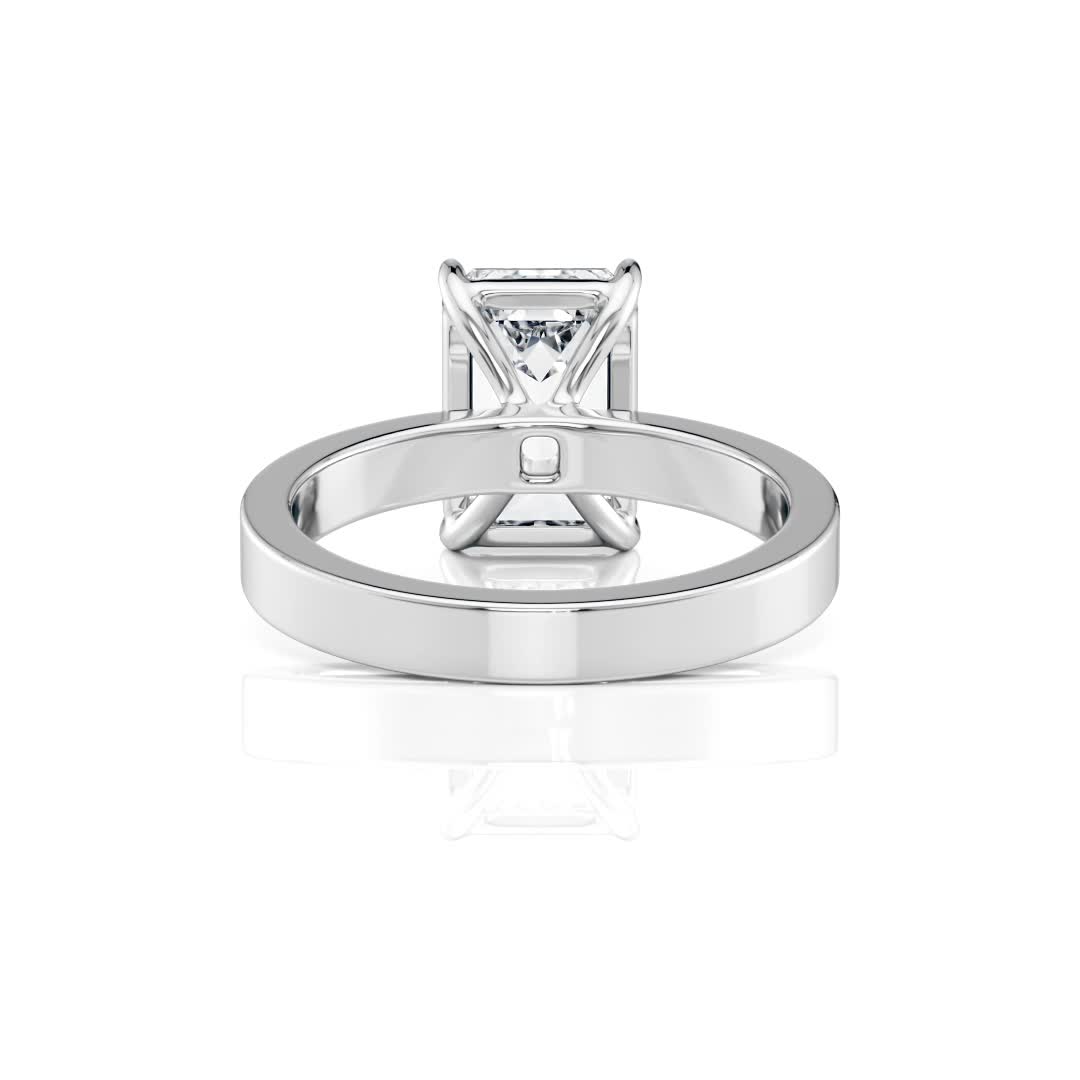 platinum solitaire cigar band with emerald shape diamond