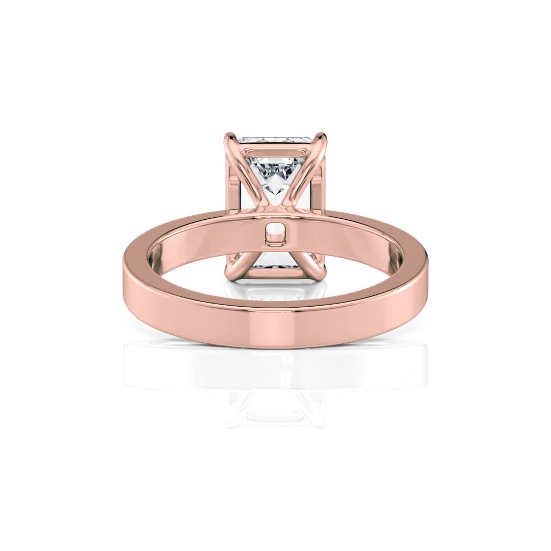 14k rose gold solitaire cigar band with emerald shape diamond