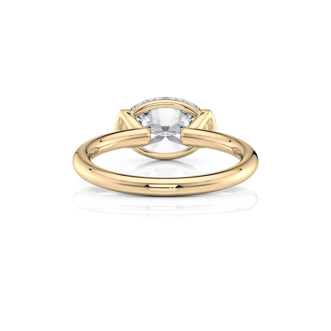 18k yellow gold east-west half bezel solitaire engagement ring with oval shape diamond