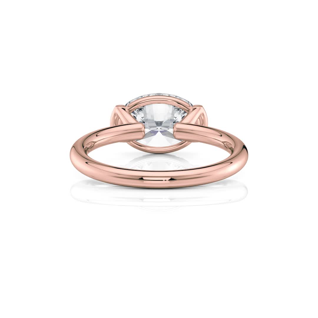 14k rose gold east-west half bezel solitaire engagement ring with oval shape diamond