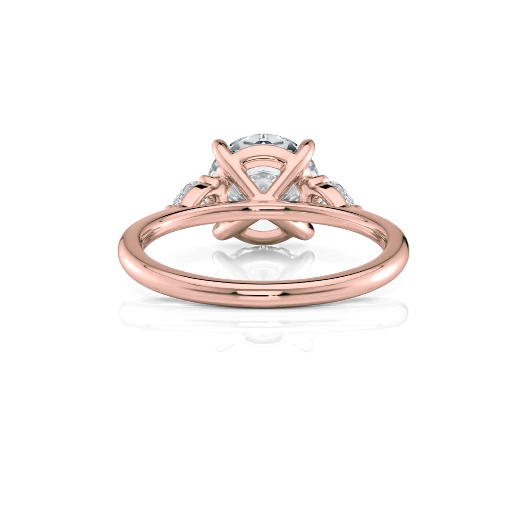 14k rose gold three stone pear lab diamond engagement ring-sits flush with a wedding band with round shape diamond