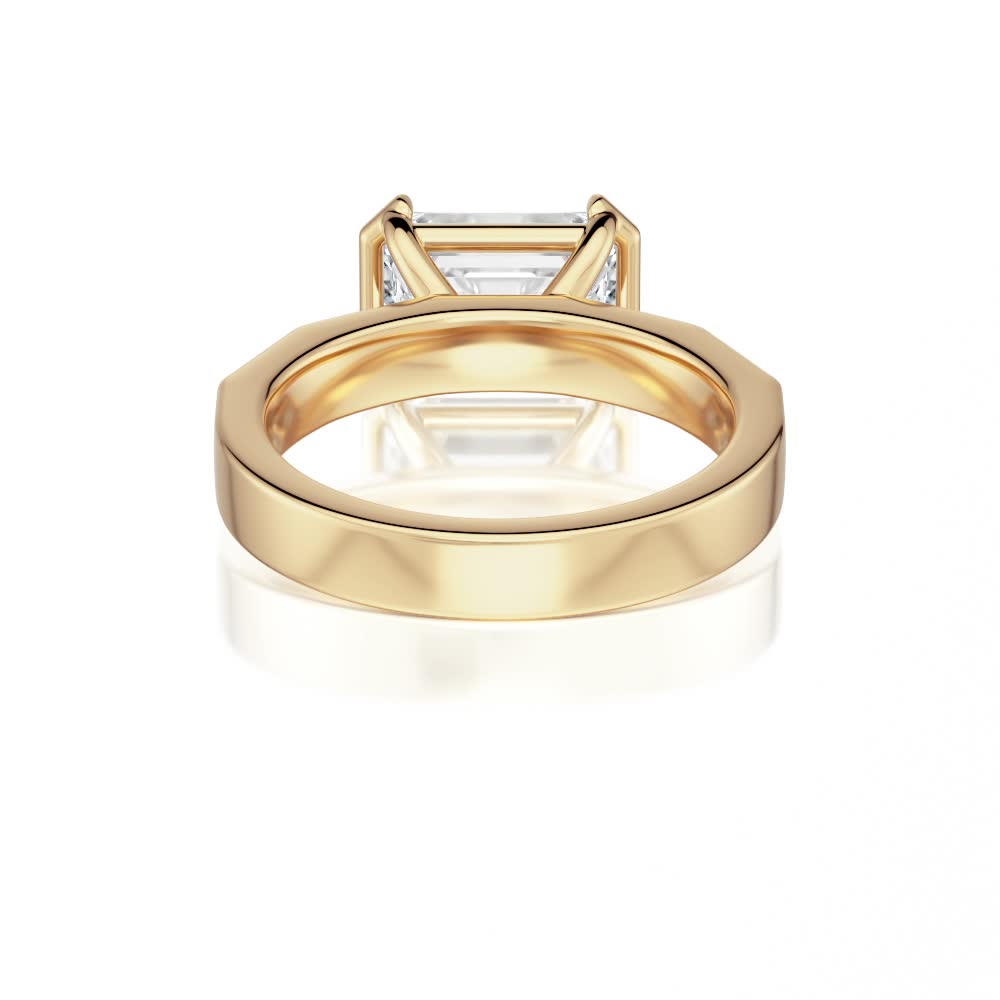 14k yellow gold e.w. geometric half bezel emerald solitaire engagement ring with emerald shape diamond