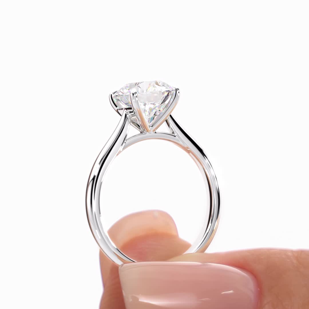 14k white gold tapered cathedral solitaire with open gallery with round shape diamond