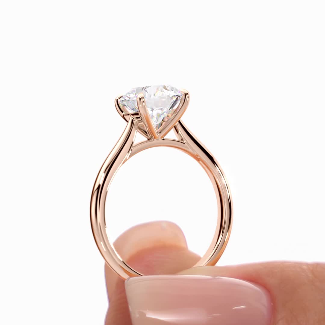 14k rose gold tapered cathedral solitaire with open gallery with round shape diamond