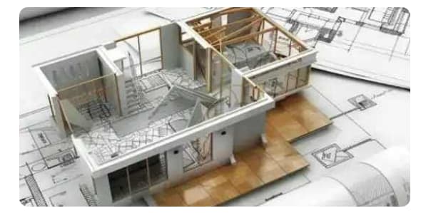Architectural house model on blueprint drawings