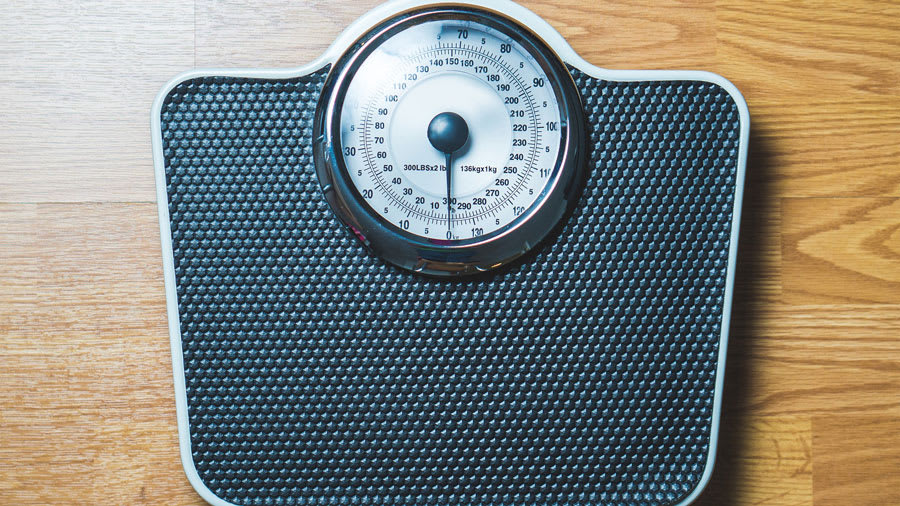 precision-scale-on-wooden-background