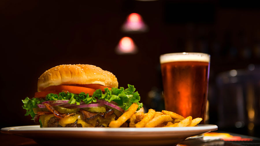 Red meat hamburger and alcohol on a table