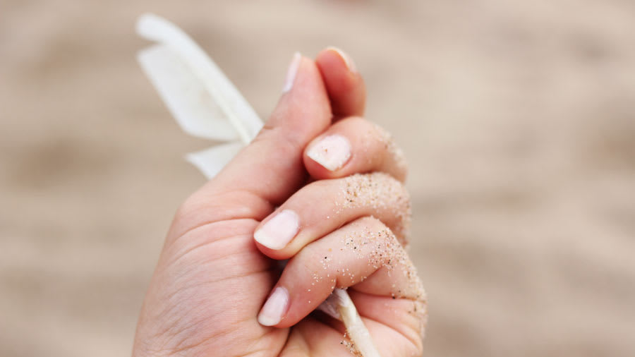 holding feather with nail symptoms
