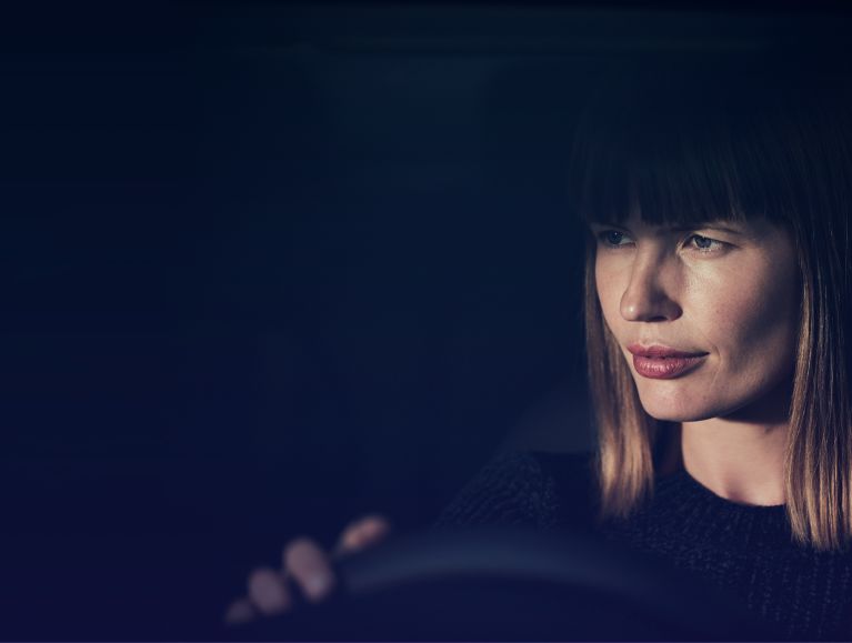 Woman at the wheel of a Mercedes-Benz vehicle