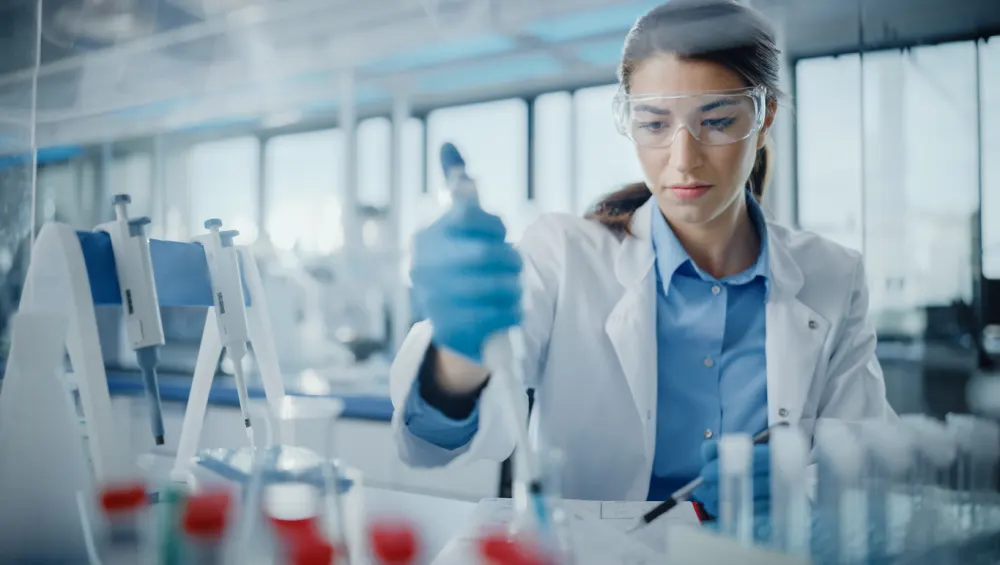 scientist in lab using lab equipment