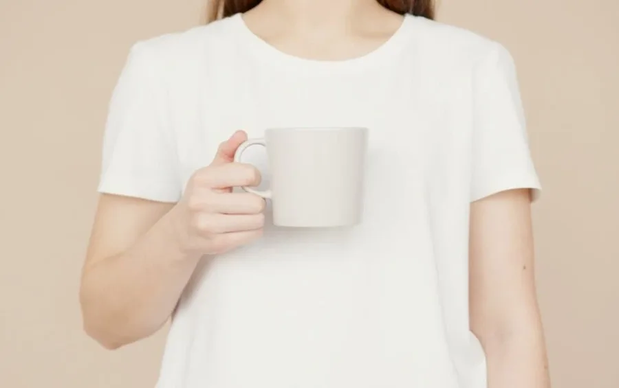 Woman drinking kratom tea