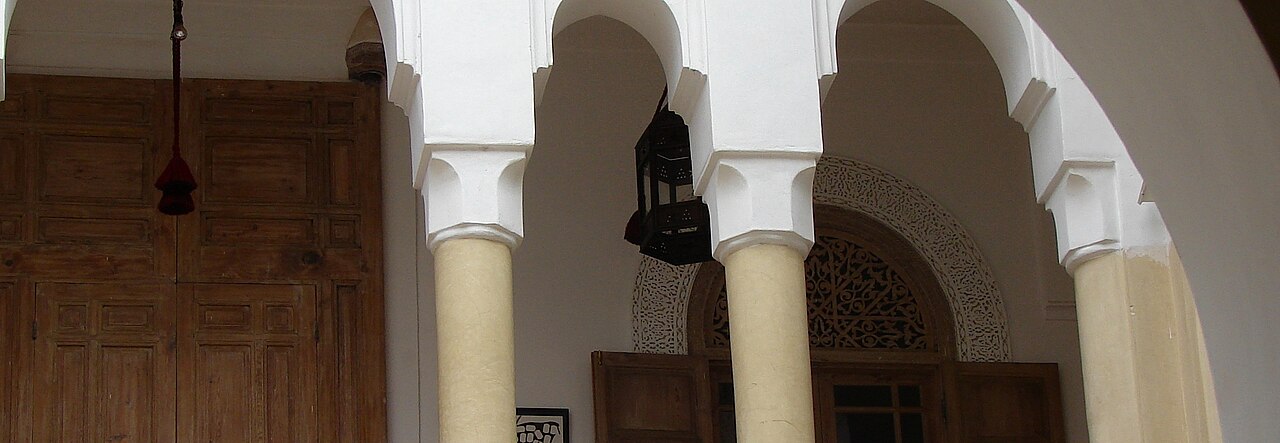 Resort with pool and palm trees