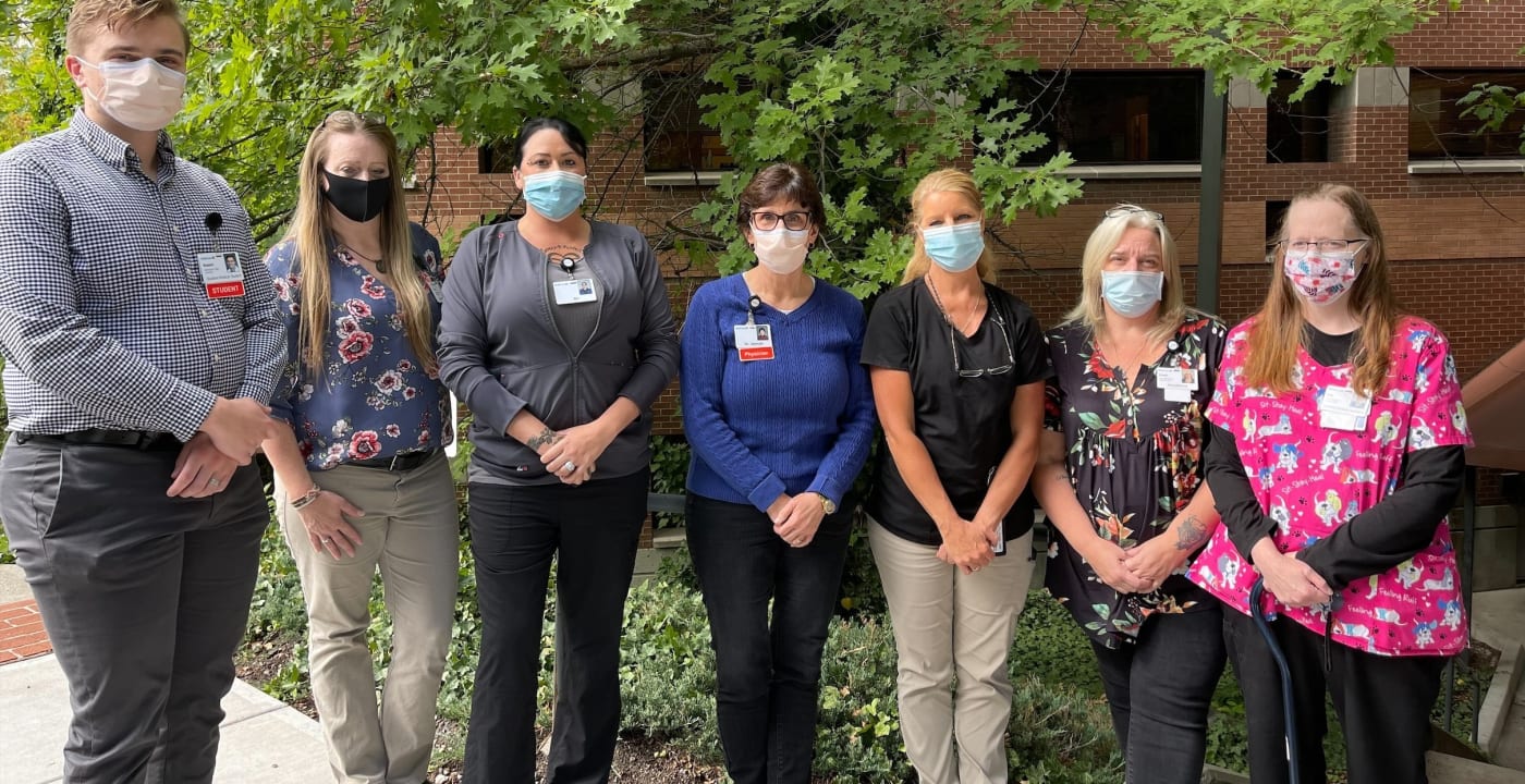 INW team posing for camera with face masks on