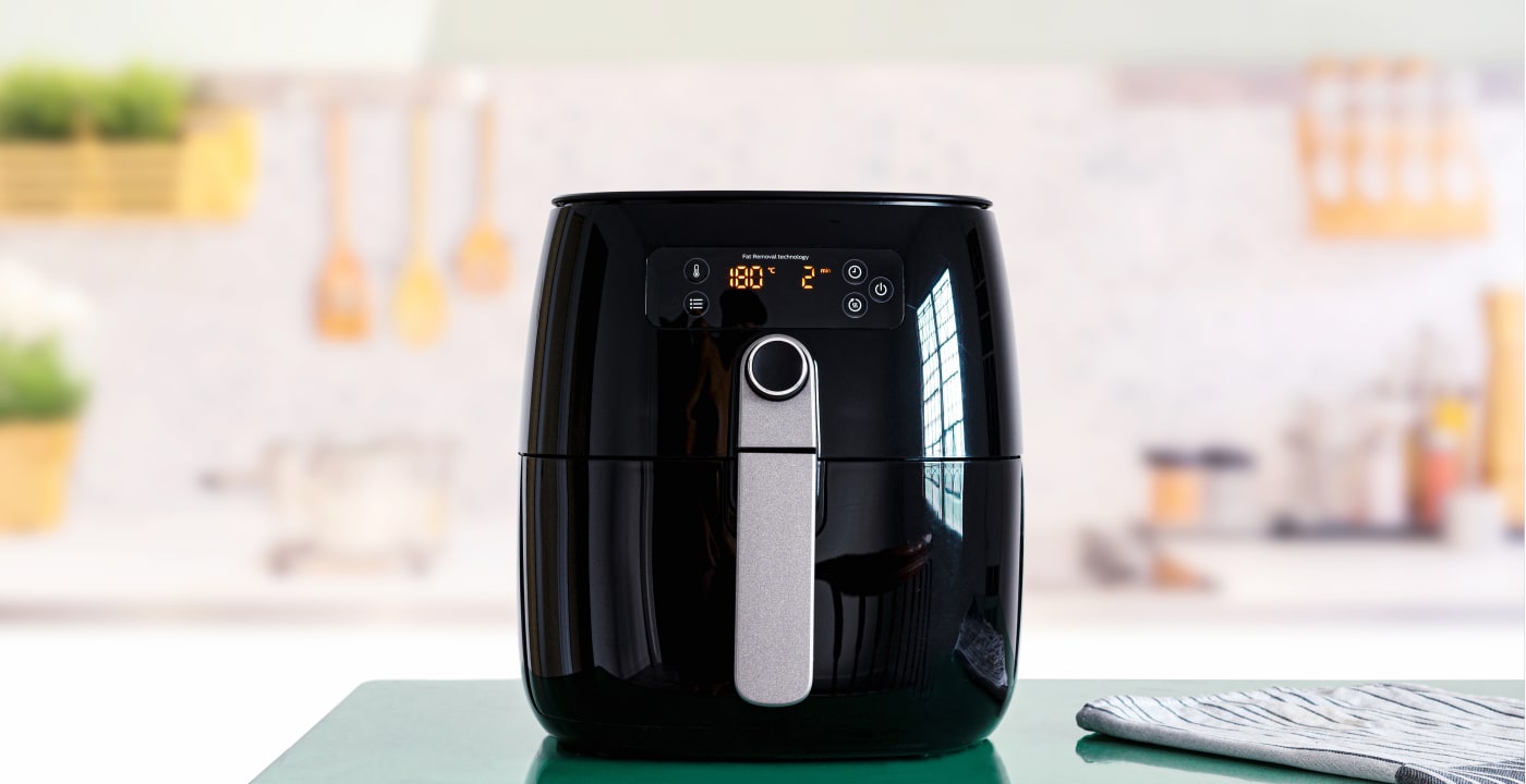 Black air fryer on kitchen counter