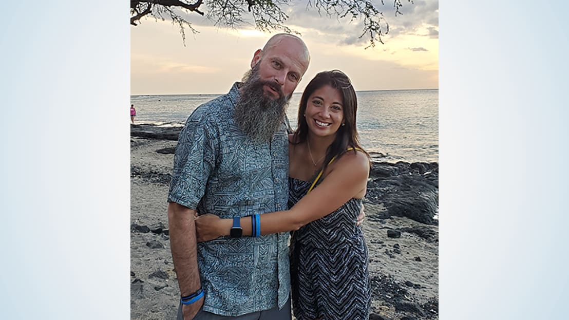 Couple posing on the beach.