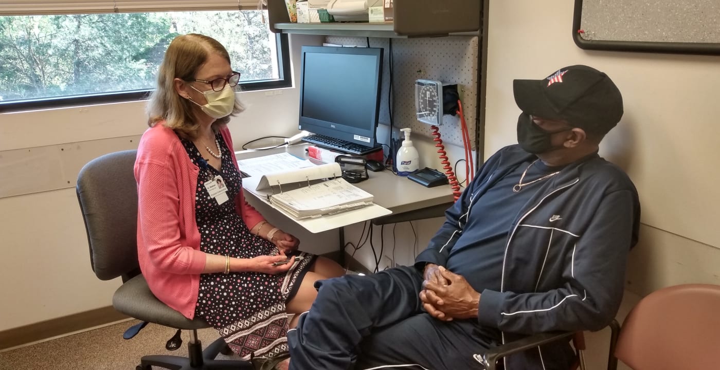 Doctor speaking to patient