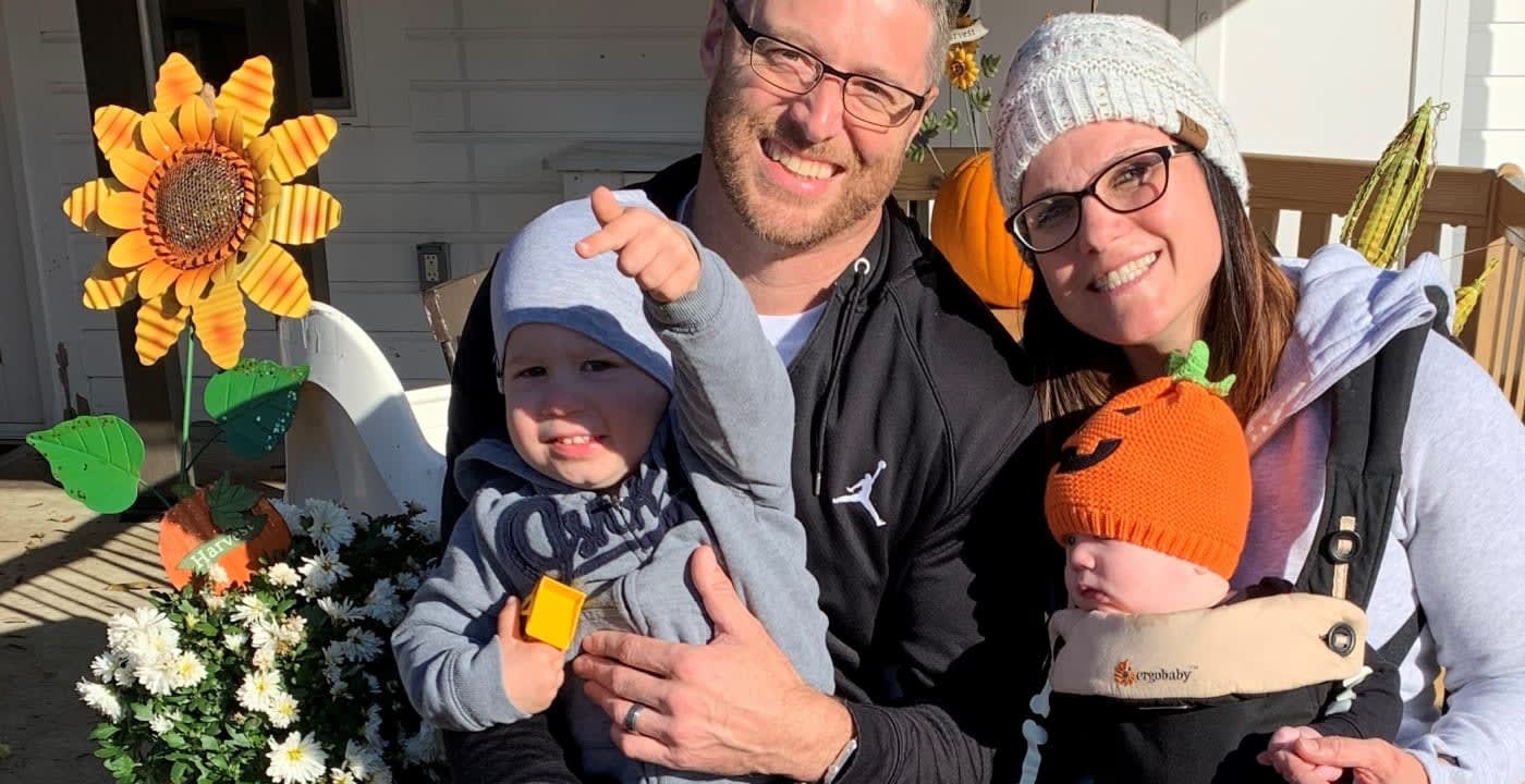 Family in a pumpkin patch posing