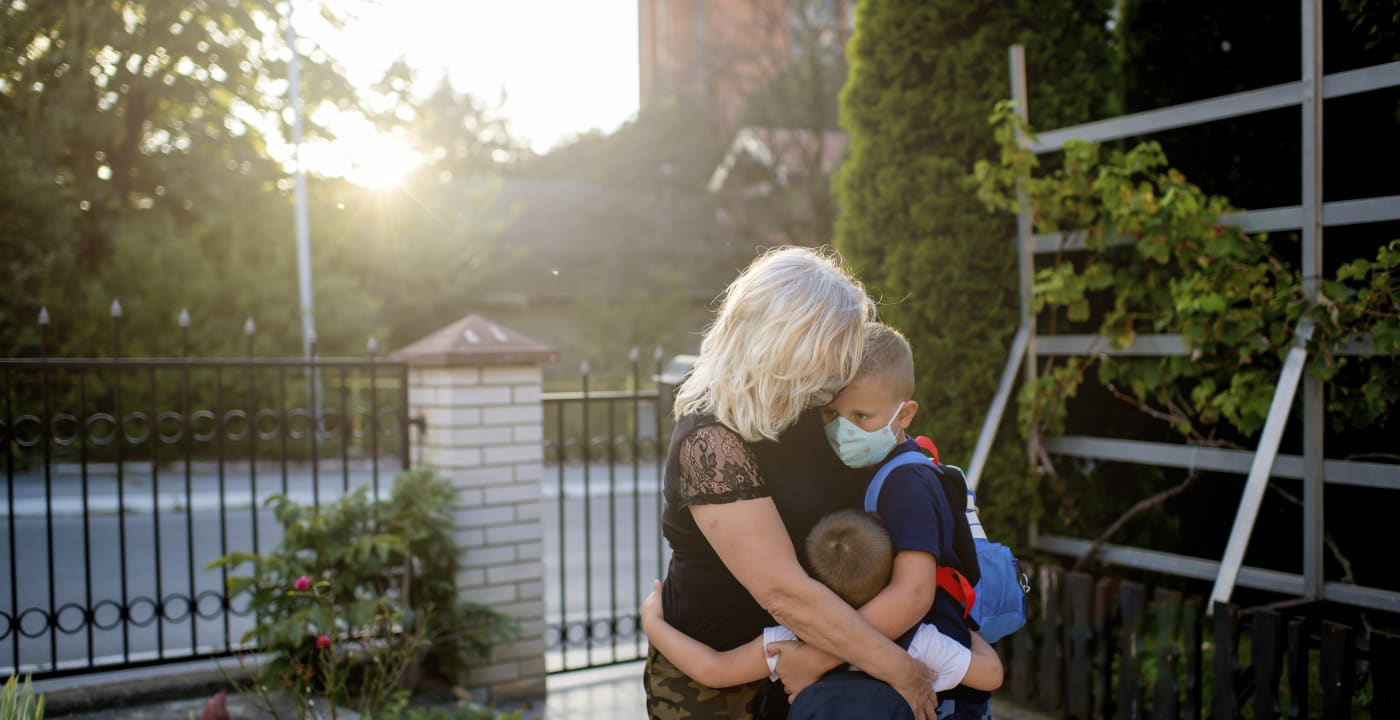 Grandmother hugging children