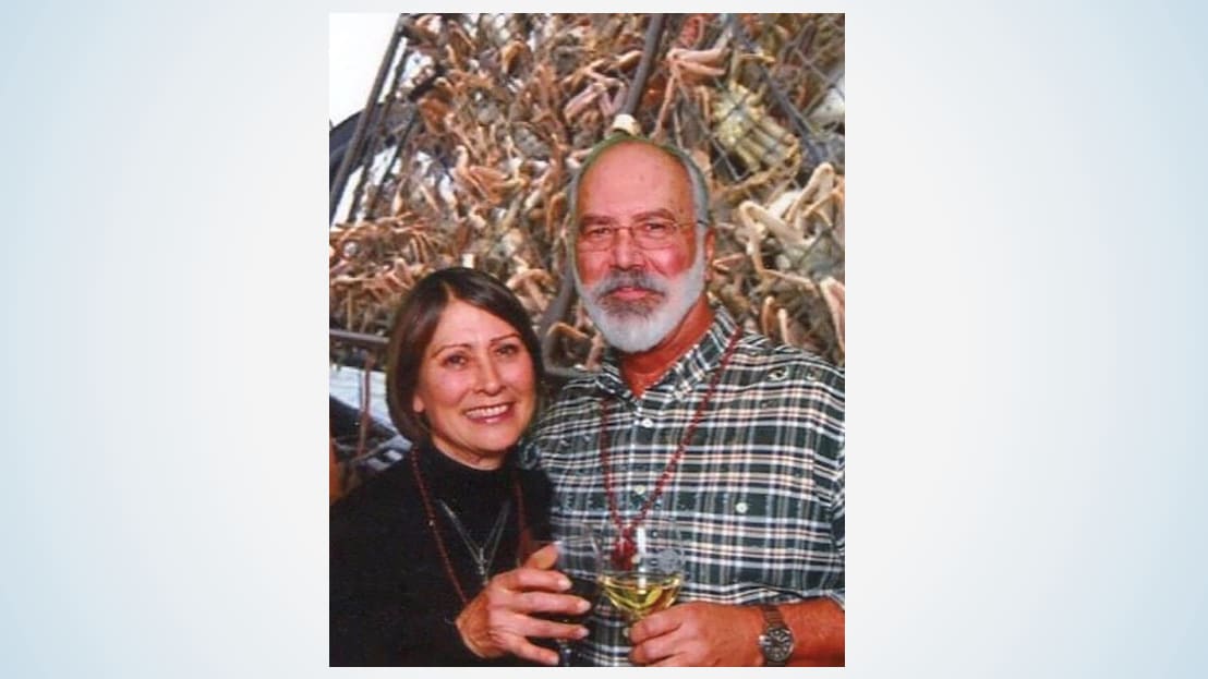 Woman and man holding wine glasses